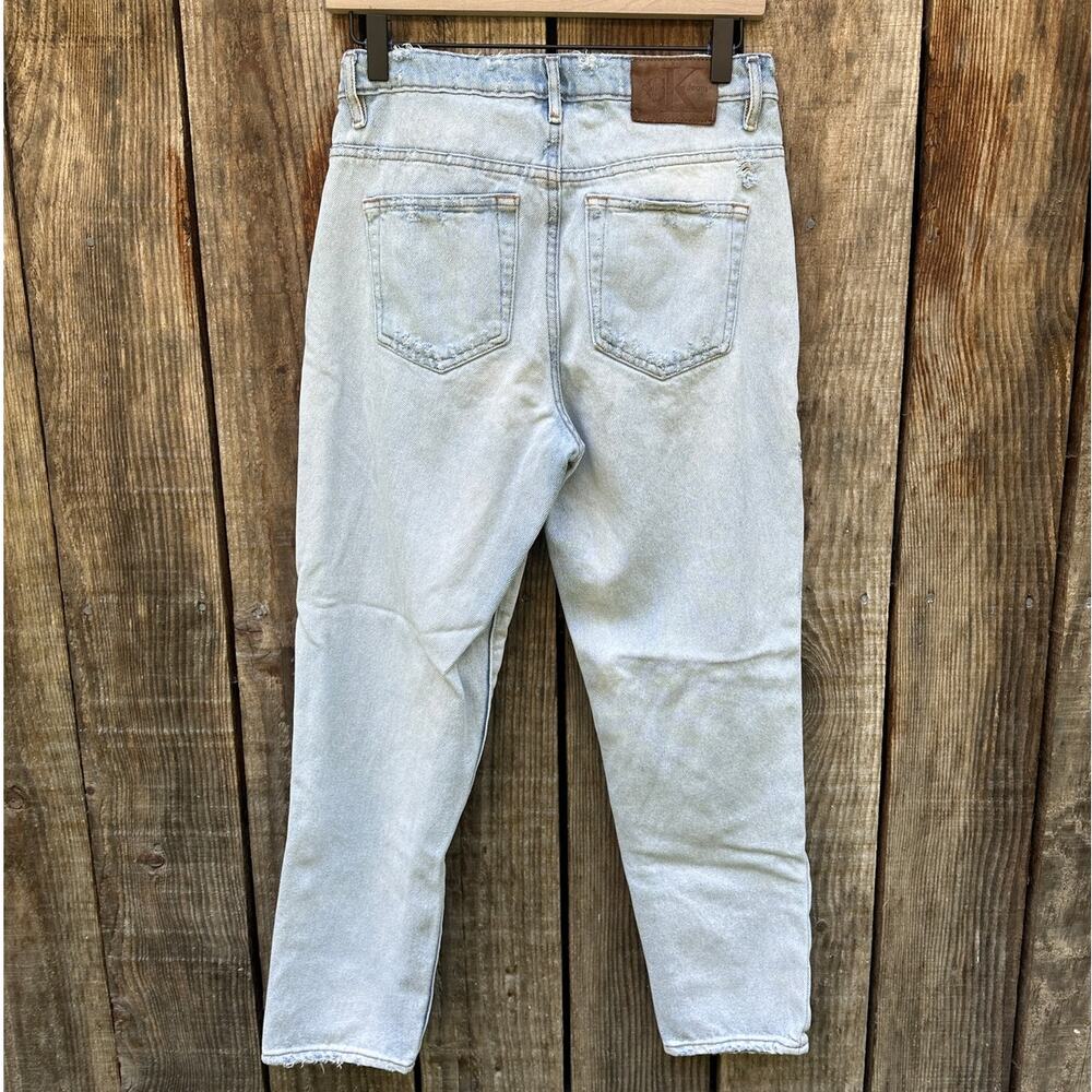 Vintage 90's Calvin Klein distressed button fly light wash jeans